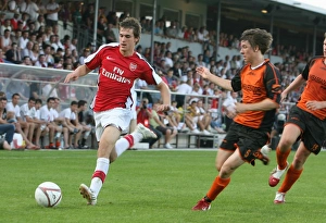 Burgenland XI v Arsenal Gallery: Aaron Ramsey (Arsenal) Michael Artner (Burgenland)
