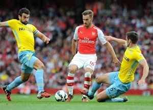 Images Dated 16th August 2014: Aaron Ramsey (Arsenal) Mile Jedinak and Scott Dann (Palace). Arsenal 2: 1 Crystal Palace