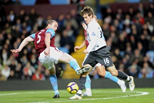 Aston Villa v Arsenal 2009-10 Gallery: Aaron Ramsey (Arsenal) Richard Dunne (Villa). Aston Villa 0: 0 Arsenal. Barclays Premier League