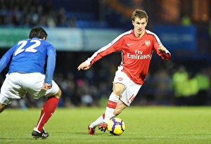 Portsmouth v Arsenal 2009-10 Collection: Aaron Ramsey (Arsenal) Richard Hughes (Portsmouth). Portsmouth 1: 4 Arsenal