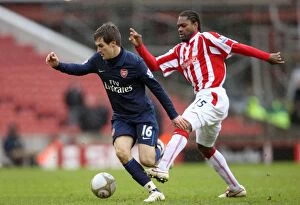 Stoke City v Arsenal - FA Cup 2009-10 Gallery: Aaron Ramsey (Arsenal) Salif Diao (Stoke). Stoke City 3: 1 Arsenal. FA Cup 4th Round
