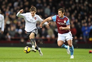 Aston Villa v Arsenal 2009-10 Gallery: Aaron Ramsey (Arsenal) Stiliyan Petrov (Villa). Aston Villa 0: 0 Arsenal