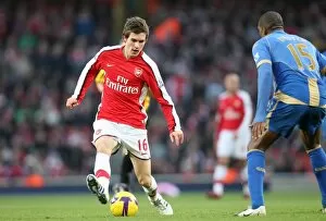 Images Dated 28th December 2008: Aaron Ramsey (Arsenal) Sylvain Distin (Portsmouth)