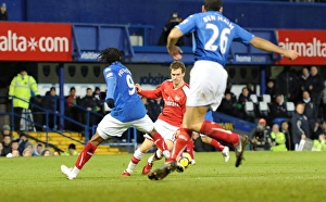 Portsmouth v Arsenal 2009-10 Collection: Aaron Ramsey breaks past Frederic Piquionne to score the 3rd Arsenal goal