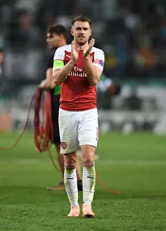 Sporting Lisbon V Arsenal 2018-19 Prints: Aaron Ramsey Celebrates with Arsenal Fans after UEFA Europa League Match vs Sporting Lisbon
