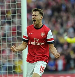 Images Dated 12th April 2014: Aaron Ramsey Celebrates Arsenal's Goal: FA Cup Semi-Final vs Wigan Athletic, 2014