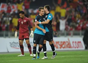 Malaysia XI V Arsenal Prints: Aaron Ramsey celebrates scoring the 1st Arsenal goal with Carl Jenkinson