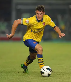 Indonesia Dream Team V Arsenal 2013-14 Prints: Aaron Ramsey Faces Off Against Indonesia All-Stars in 2013 Jakarta Showdown