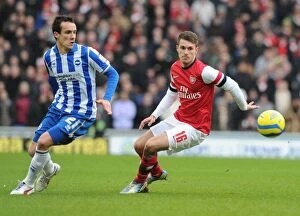 Images Dated 26th January 2013: Aaron Ramsey Outmaneuvers David Lopez: FA Cup Clash Between Brighton & Arsenal