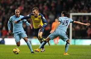 Images Dated 18th January 2015: Aaron Ramsey Outmaneuvers Jesus Navas and Fernando: Manchester City vs Arsenal