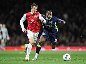 Images Dated 16th April 2012: Aaron Ramsey Outsmarts Maynor Figueroa: Arsenal's Masterclass in the 2012 Match against Wigan