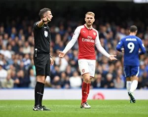 Images Dated 17th September 2017: Aaron Ramsey Protests to Referee Michael Oliver during Chelsea vs Arsenal Premier League Clash