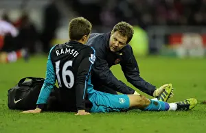 Aaron Ramsey Receives Treatment from Physio Colin Lewin during Sunderland vs Arsenal FA Cup Match