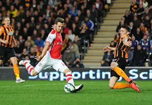 Hull City V Arsenal 2014/15 Prints: Aaron Ramsey scores Arsenals 2nd goal under pressure from Robbie Brady (Hull)
