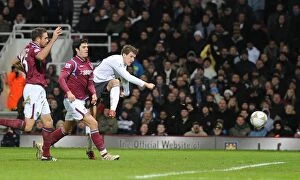West Ham United v Arsenal FA Cup 2009-10 Collection: Aaron Ramsey shoots past West Ham goalkeeper Rob Green to score the 1st Arsenal goal