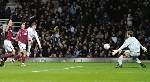 Images Dated 3rd January 2010: Aaron Ramsey shoots past West Ham goalkeeper Rob Green to score the 1st Arsenal goal