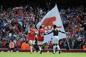 Arsenal v Manchester United 2010-2011 Collection: Aaron Ramsey, Theo Walcott and Emmanuel Eboue (Arsenal) celebrate at the end of the match