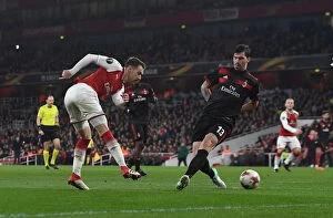 Images Dated 15th March 2018: Aaron Ramsey vs Alessio Romagnoli: Tense Moment at the Emirates - Arsenal vs AC Milan