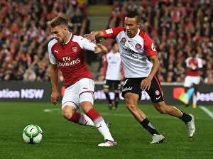 Sydney Western Wanderers V Arsenal 2017-18 Prints: Aaron Ramsey vs. Brendan Hamill: Clash of the Midfielders - Arsenal vs