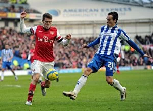Images Dated 26th January 2013: Aaron Ramsey vs. David Lopez: Intense Battle in FA Cup Match between Brighton & Arsenal