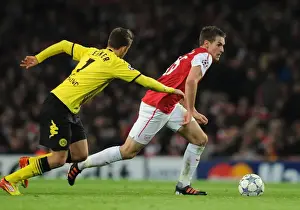 Arsenal V Borussia Dortmund 2011-12 Prints: Aaron Ramsey vs. Felipe Santana: Clash at the Emirates - Arsenal v Borussia Dortmund