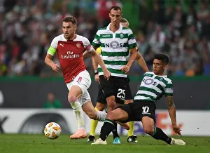 Sporting Lisbon V Arsenal 2018-19 Prints: Aaron Ramsey vs. Fredy Montero: Clash in the UEFA Europa League between Sporting CP and Arsenal