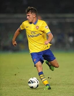 Indonesia Dream Team v Arsenal 2013-14 Collection: Aaron Ramsey vs. Indonesia All-Stars: Arsenal Star's Showdown in Jakarta (July 2013)