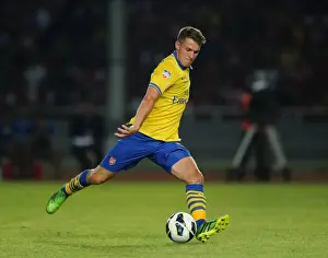 Indonesia Dream Team V Arsenal 2013-14 Prints: Aaron Ramsey vs Indonesia All-Stars: Arsenal Star Faces Off in 2013-14 Tour