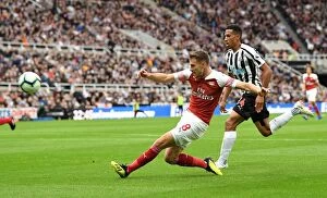 Images Dated 15th September 2018: Aaron Ramsey vs. Isaac Hayden: Intense Battle in Newcastle United vs