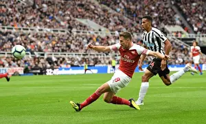 Newcastle United V Arsenal 2018-19 Prints: Aaron Ramsey vs. Isaac Hayden: Intense Battle in Newcastle United vs