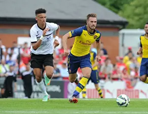 Boreham Wood V Arsenal Prints: Aaron Ramsey vs Lee Angol: Battle in Arsenal's Pre-Season Clash against Boreham Wood