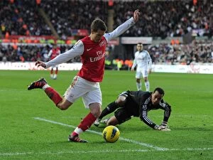 Swansea City v Arsenal 2011-12 Collection: Aaron Ramsey vs. Michel Vorm: Battle at the Swansea Goal