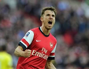 Images Dated 12th April 2014: Aaron Ramsey's Euphoric Moment: Arsenal's FA Cup Semi-Final Goal Against Wigan Athletic (2014)