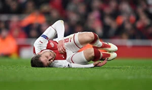 Images Dated 15th March 2018: Aaron Ramsey's Injury Marrs Arsenal in Europa League Clash Against AC Milan
