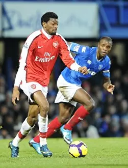Portsmouth v Arsenal 2009-10 Collection: Abou Diaby (Arsenal) Aaron Mokoena (Portsmouth). Portsmouth 1: 4 Arsenal