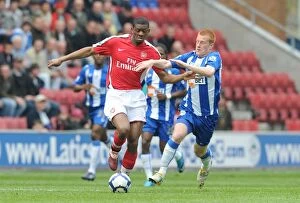 Wigan Athletic v Arsenal 2009-10 Gallery: Abou Diaby (Arsenal) Ben Watson (Wigan). Wigan Athletic 3: 2 Arsenal, FA Barclays Premier League