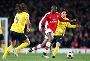 Arsenal V Barcelona 2009-10 Prints: Abou Diaby (Arsenal) Carles Puyol and Lionel Messi (Barcelona). Arsenal 2: 2 Barcelona
