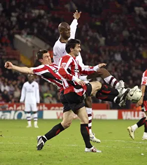 Abou Diaby (Arsenal) Chris Morgan and Keith Gillespie (Sheff)