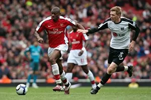 Arsenal v Fulham 2009-10 Collection: Abou Diaby (Arsenal) David Elm (Fulham). Arsenal 4: 0 Fulham. Barclays Premier League