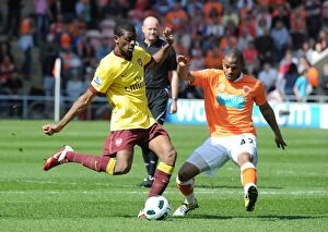 Images Dated 10th April 2011: Abou Diaby (Arsenal) Jason Puncheon (Blackpool). Blackpool 1: 3 Arsenal