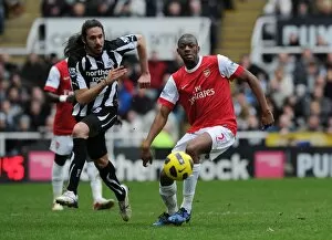 Images Dated 5th February 2011: Abou Diaby (Arsenal) Jonas Guitierrez (Newcastle). Newcastle United 4: 4 Arsenal