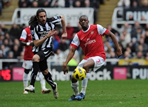 Newcastle United V Arsenal 2010-11 Prints: Abou Diaby (Arsenal) Jonas Guitierrez (Newcastle). Newcastle United 4: 4 Arsenal
