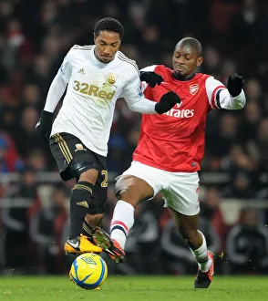 Arsenal v Swansea - FA Cup 3rd Rd Replay 2012-13 Collection: Abou Diaby (Arsenal) Jonathan De Guzman (Swansea). Arsenal 1: 0 Swansea City. FA Cup