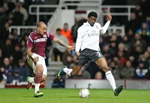 West Ham United v Arsenal FA Cup 2009-10 Collection: Abou Diaby (Arsenal) Julien Faubert (West Ham). West Ham United 1: 2 Arsenal