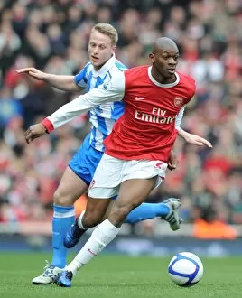 Images Dated 30th January 2011: Abou Diaby (Arsenal) Lee Peltier (Huddersfield). Arsenal 2: 1 Huddersfield Town
