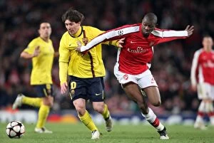 Images Dated 31st March 2010: Abou Diaby (Arsenal) Lionel Messi (Barcelona). Arsenal 2: 2 Barcelona. UEFA Champions League