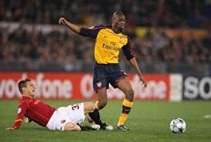 Images Dated 11th March 2009: Abou Diaby (Arsenal) Matteo Brighi (Roma)
