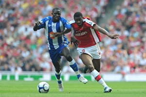 Arsenal V Wigan Athletic 2009-10 Prints: Abou Diaby (Arsenal) Mohamed Diame (Wigan)