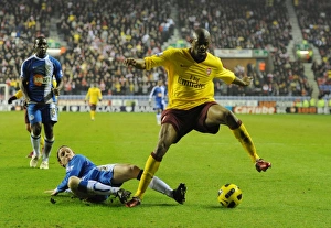 Abou Diaby (Arsenal) Ronnie Stam (Wigan). Wigan Athletic 2:2 Arsenal, DW Stadium Abou Diaby (Arsenal) Ronnie Stam (Wigan). Wigan Athletic 2:2 Arsenal, DW Stadium