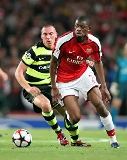 Images Dated 26th August 2009: Abou Diaby (Arsenal) Scott Brown (Celtic)